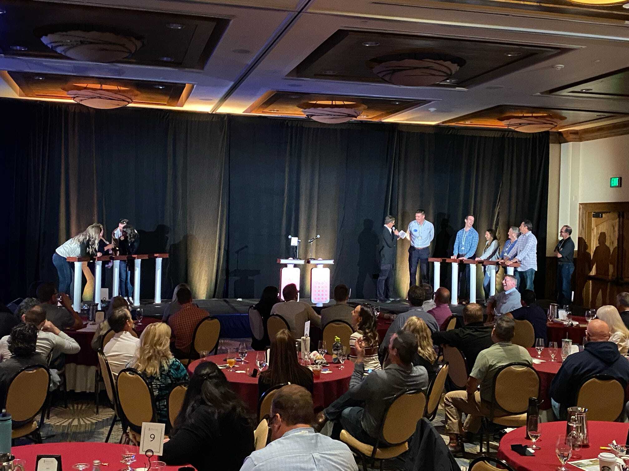 A group of people sitting at tables in a room.