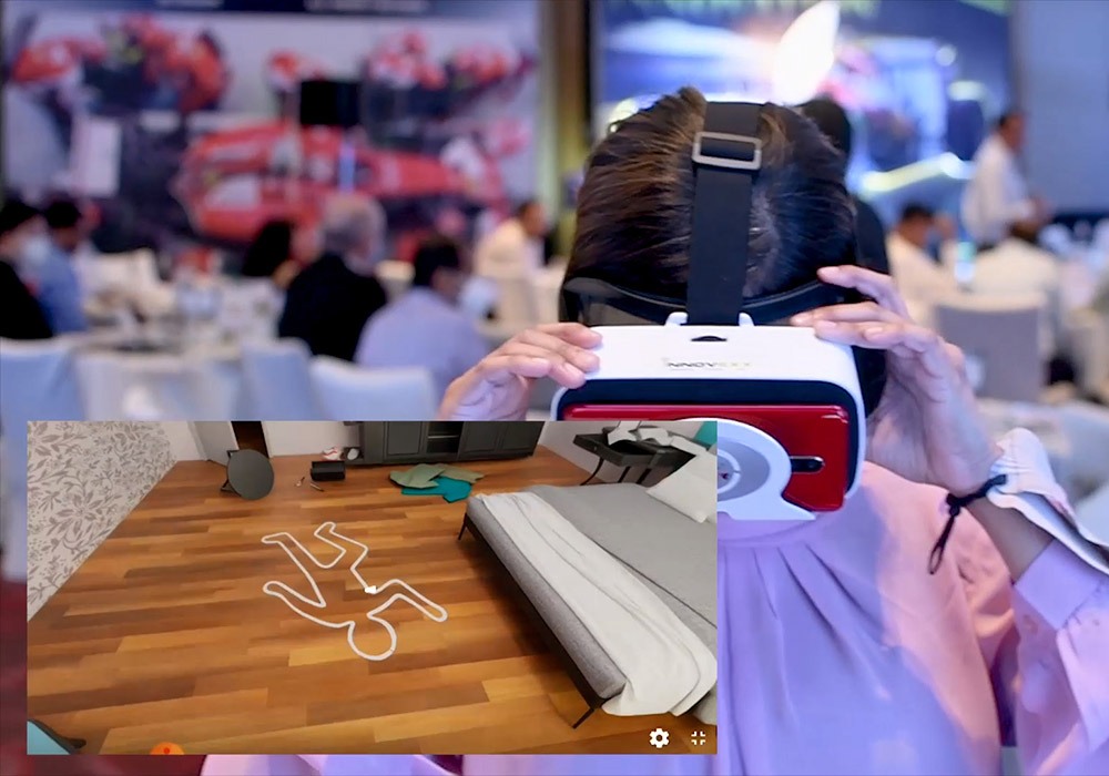 A woman is using a virtual reality headset at a conference.