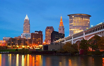 A city skyline reflected in a body of water.