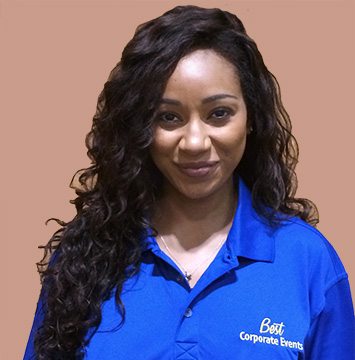 A woman in a blue polo posing for a photo.