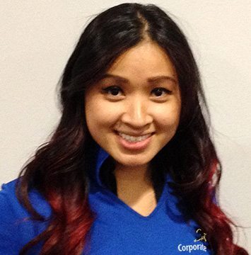 A smiling woman in a blue shirt.