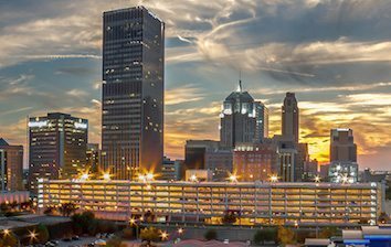 The skyline of oklahoma city at sunset.