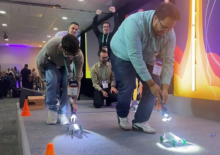 A group of people playing a game on a stage.