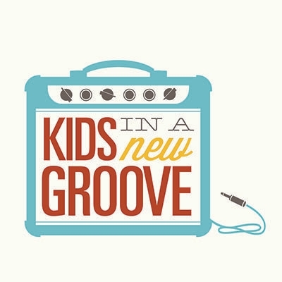 Logo of "Kids in a New Groove," featuring the text inside an illustrated guitar amplifier with a blue audio cable on a light background.