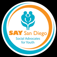 A circular logo with the text "SAY San Diego Social Advocates for Youth" and an abstract design of people in blue and orange colors.