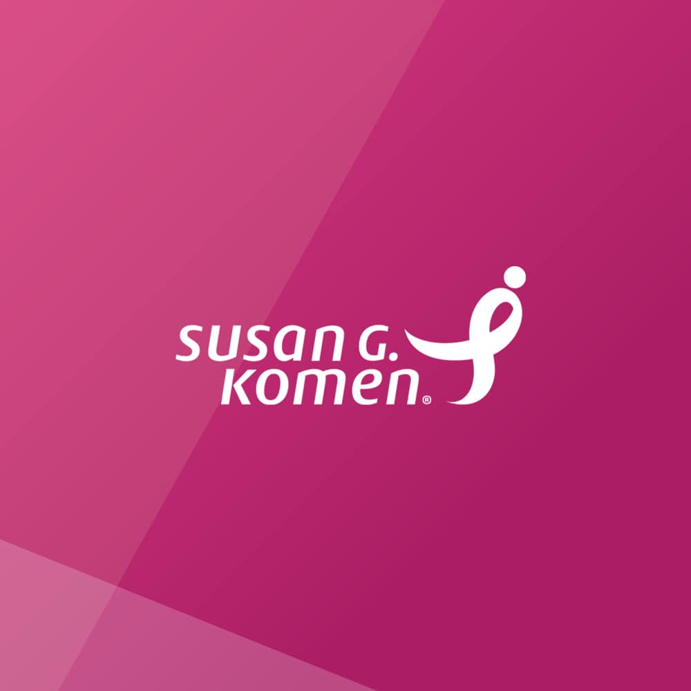Pink background with the Susan G. Komen logo in the center. The logo includes a stylized ribbon and the text "susan g. komen.