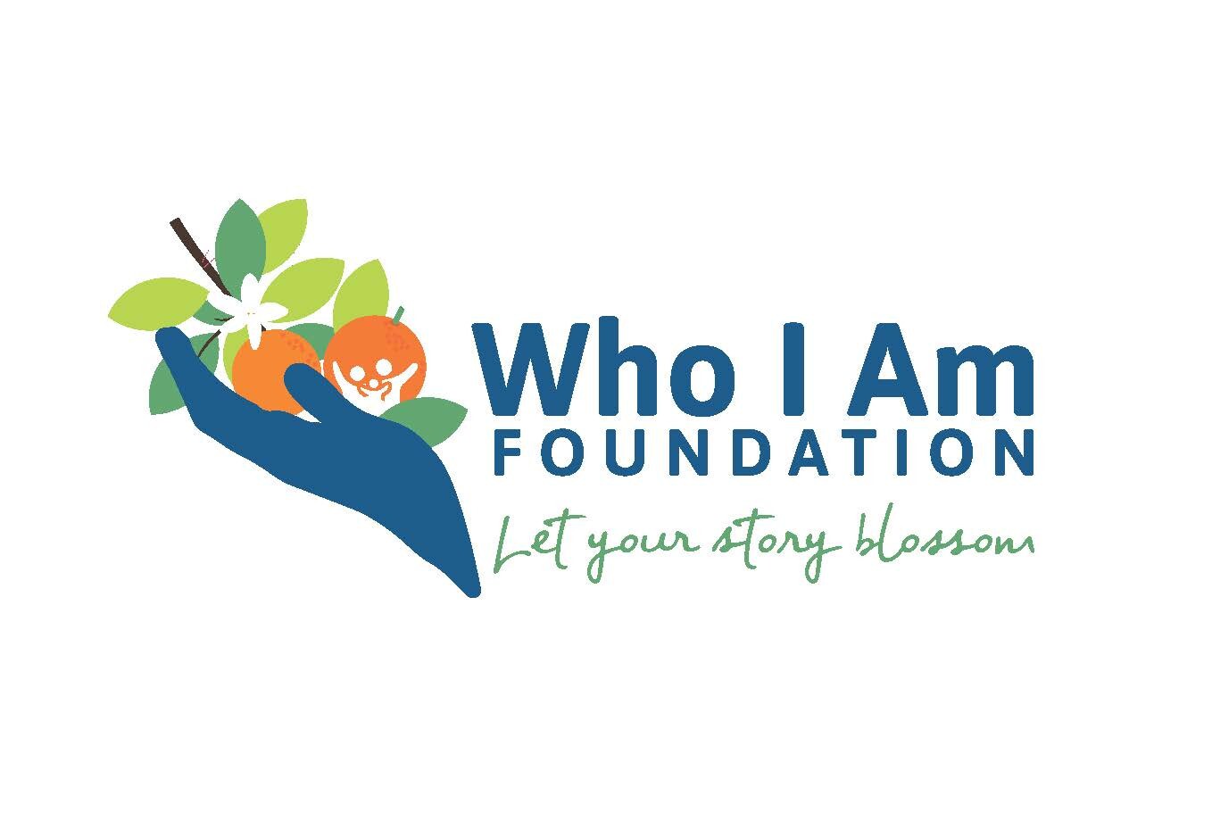 Logo of Who I Am Foundation, featuring a blue hand holding fruit and flowers, with the tagline "Let your story blossom.