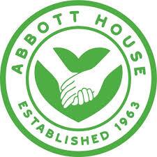 Circular logo with the text "Abbott House Established 1963" surrounding two hands clasping in front of a stylized heart, all in green.