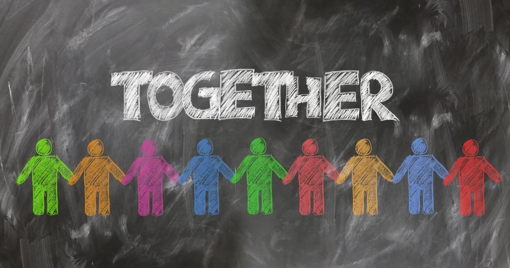 A chalkboard with the word together drawn on it, keeping remote teams connected.