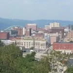 An awe-inspiring view of a city from the top of a hill, perfect for Wheeling corporate events.