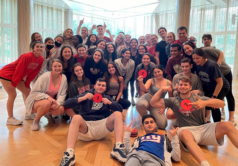 A group of people posing for a picture in a room.