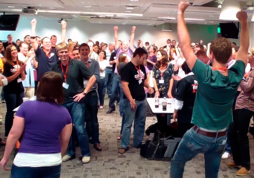 A group of people dancing in a room.