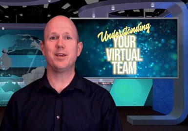 A man standing in front of a sign.