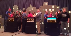 A group of people standing in front of a stage.