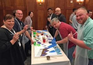 A group of people posing for a picture at a table.