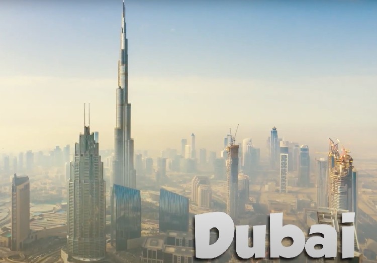 The skyline of dubai with the words dubai written on it.