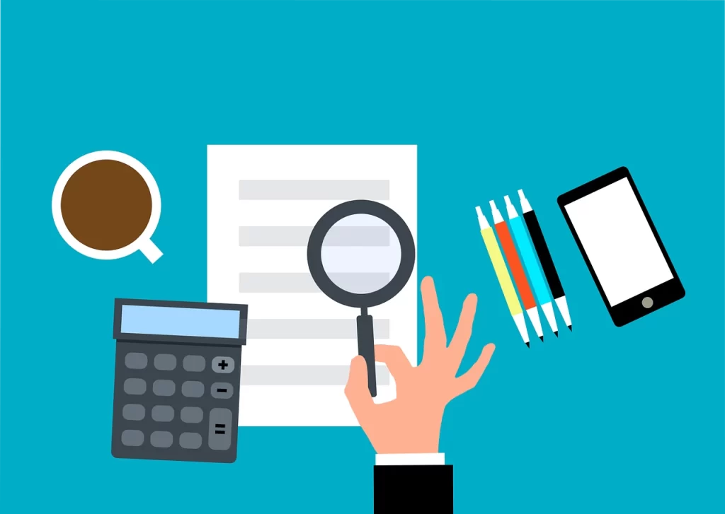 A hand holding a calculator, with emphasis on team building program customization through careful examination and analysis.