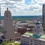 An aerial view of a city with tall buildings.