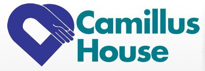A logo with a purple heart featuring two hands shaking, accompanied by the text "Camillus House" in teal.