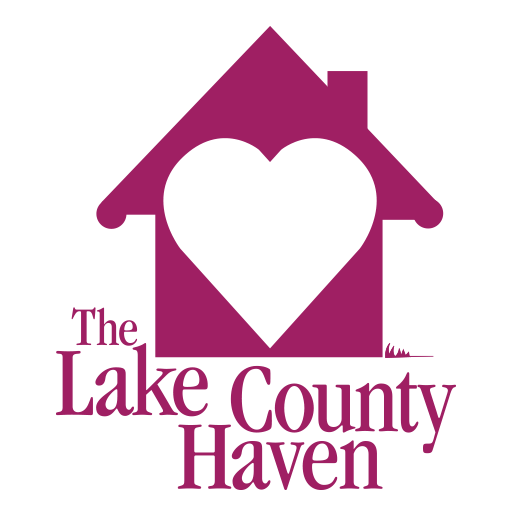 Logo of The Lake County Haven featuring a maroon house with a white heart in the center and text below the house.