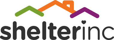 The image shows a logo with a house icon in orange, green, and purple above the text "Shelter Inc" in lowercase. A heart replaces the dot on the "i" in "Inc.